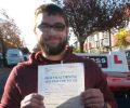 Daniel with Driving test pass certificate